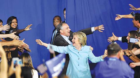 TOPSHOT- US Democratic Presidential candidate Hillary Clinton and running mate US Senator Tim Kaine arrive for a campaign rally at Florida International University in Miami