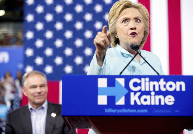 Democratic presidential candidate Hillary Clinton accompanied by Sen. Tim Kaine D-Va. speaks at a rally at Florida International University Panther Arena in Miami Saturday