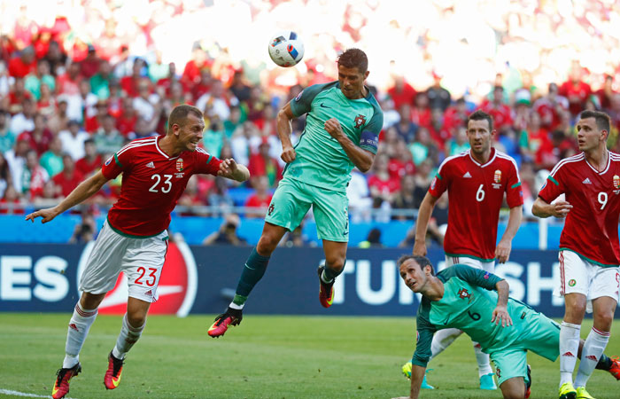 Portugal's Cristiano Ronaldo scores a goal against Hungary in Lyon France Wednesday. — Reuters