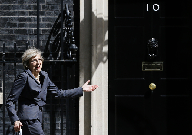 Britain's Home Secretary Theresa May gestures as she leaves after attending a cabinet meeting at 10 Downing Street in London Tuesday