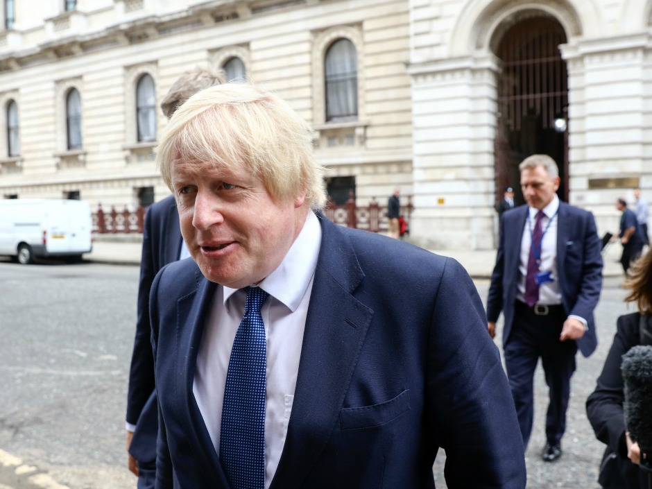 U.K. foreign secretary Boris Johnson walks outside the foreign office in the Westminster district of London on Thursday