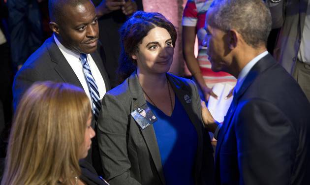 President Barack Obama greets people in the audience after participating in a town hall with ABC news anchor David Muir officers parents students community leaders and families on trust and safety in communities Thursday