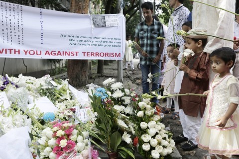 Victims&#39 family members place flowers to pay tribute to the victims of July 1 Dhaka terror attack in Dhaka Bangladesh