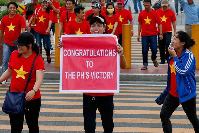 Vietnamese protesters congratulate the Philippines on its win in The Hague