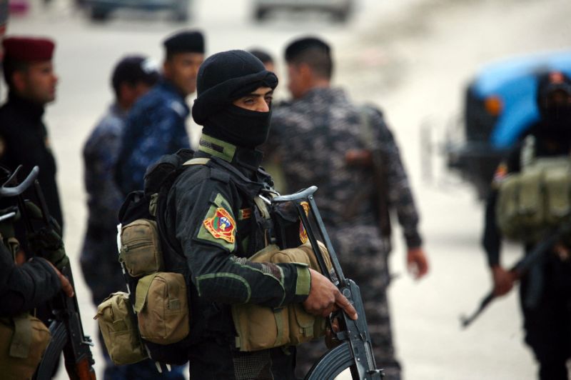 A member of Iraqi security forces stands guard