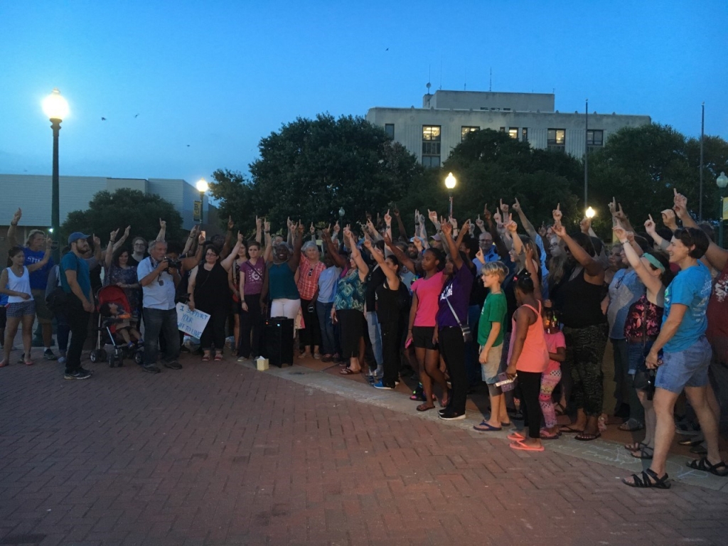 Vigil attendees write'My Life Matters on take