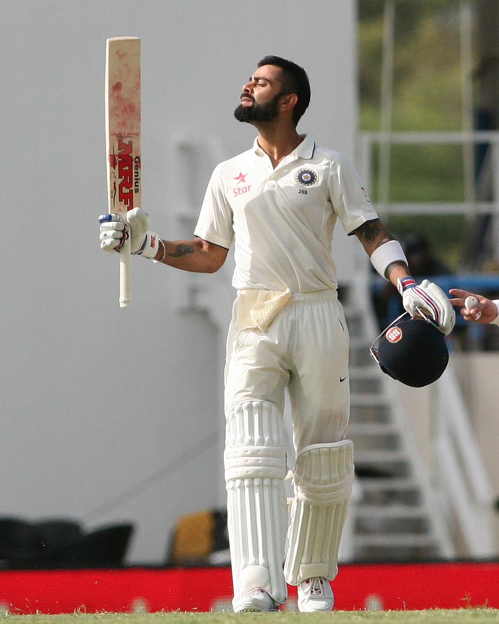 Virat Kohli celebrating his century on day one of the Antigua Test