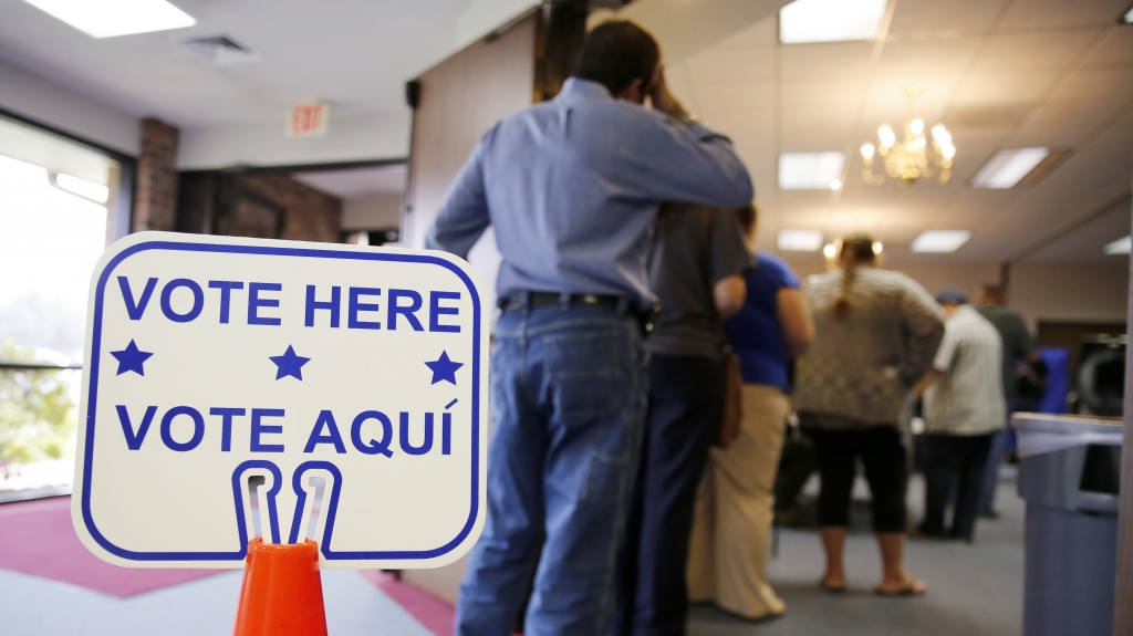 Voters stand in line to cast their ballots inside Calvary Baptist Church in Rosenberg Texas on March 1 during the primaries