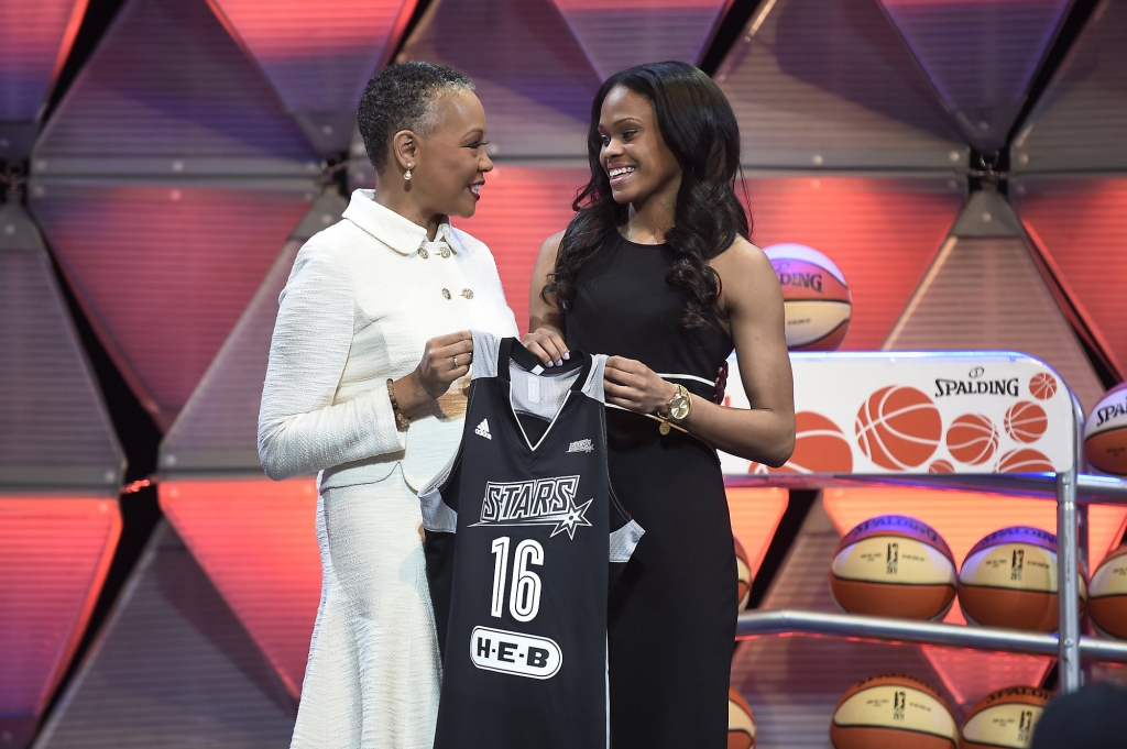 Connecticut's Moriah Jefferson right and WNBA President Lisa Borders hold a San Antonio Stars jersey after Jefferson was selected with the second pick in the WNBA basketball draft in Uncasville Conn. WNBA