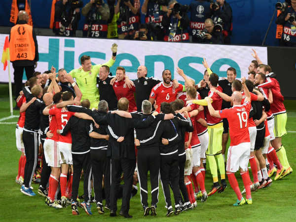 Wales players celebrate after beating Belgium 3-1