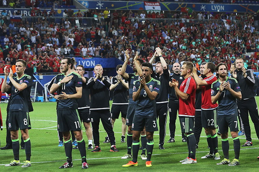 Wales players react after the 2016 UEFA European Football Championship semifinal match against Portugal at Stade de Lyon