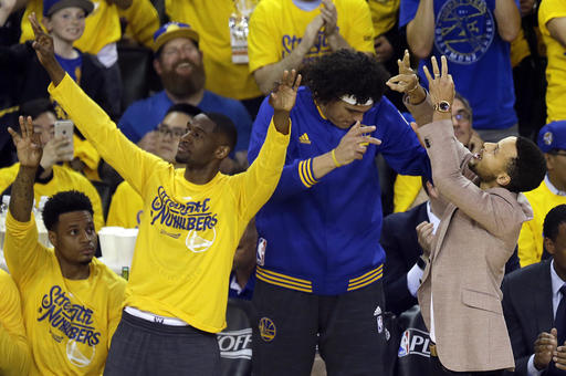 Golden State Warriors&#039 Brandon Rush Ian Clark Anderson Varejao and Stephen Curry from left celebrate a score against the Houston Rockets during the first half in Game 5 of a first-round NBA basketball playoff series Wednesday