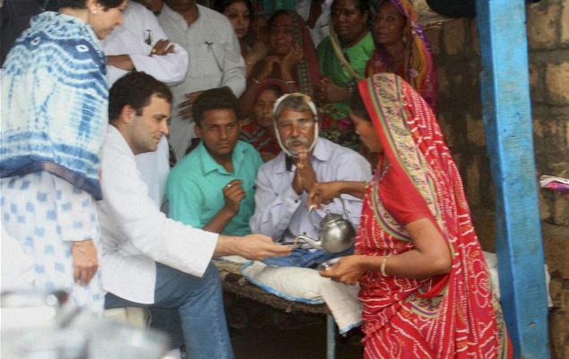 Congress Vice President Rahul Gandhi is served tea as he meets one of Dalit
victims beaten up by cow protectors few days ago at Una in Rajkot district on
Thursday