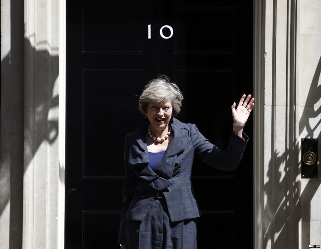 Wednesday waves as she leaves after a cabinet meeting at number 10 Downing Street in central London Britain