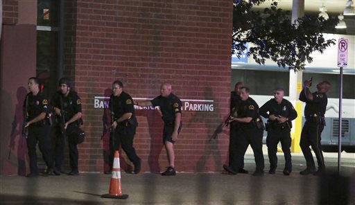 Dallas police respond after shots were fired during a protest over recent fatal shootings by police in Louisiana and Minnesota Thursday