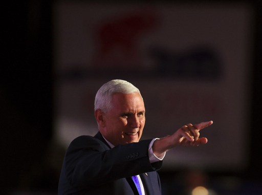 Republican Vice Presidential Nominee Mike Pence gestures as he arrives to speak during the Republican National Convention at the Quicken Loans Arena in Cleveland Ohio