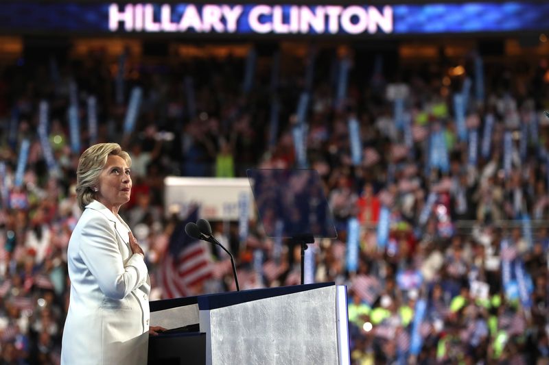 Democratic presidential candidate Hillary Clinton acknowledges the crowd as she arrives on stage during the fourth day of the Democratic National Convention