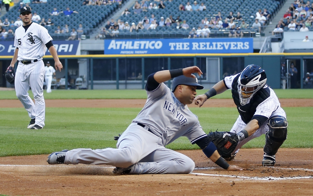 White Sox catcher Alex Avila tags out Carlos Beltran during the first inning Tuesday. Avila injured his hamstring during the fourth inning