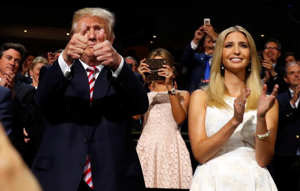 Republican U.S. presidential nominee Donald Trump gives two thumbs up as he stands in the Trump family box with his daughter Ivanka awaiting the arrival onstage of his son Eric at the conclusion of former rival candidate Senator Ted Cruz's addres