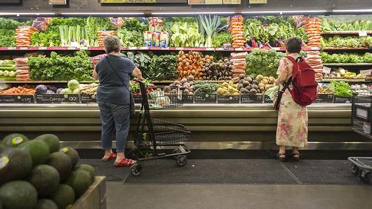 Shoppers browse produce at the Whole Foods Market