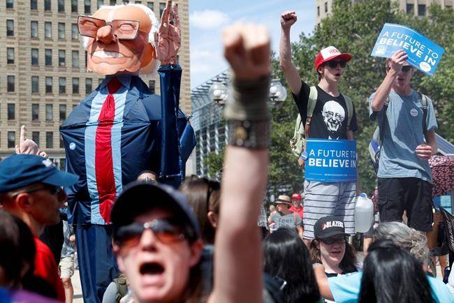 Delegates hold Hillary Clinton signs after she was named the Democratic nominee for president at the Democratic National Convention in Philadelphia Pennsylvania