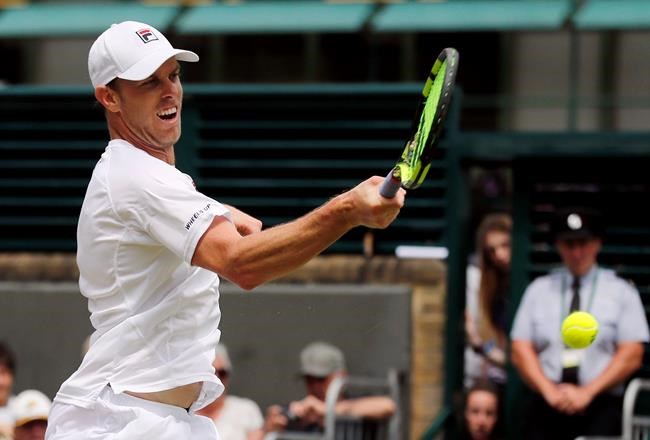 Sam Querrey of the U.S returns to Nicolas Mahut of France during their men's singles match on day eight of the Wimbledon Tennis Championships in London Monday