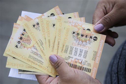 A person shows Powerball tickets she bought on Tuesday Jan. 12 2016 in San Lorenzo Calif. The Powerball jackpot has grown to over 1 billion dollars for the next drawing on Wednesday