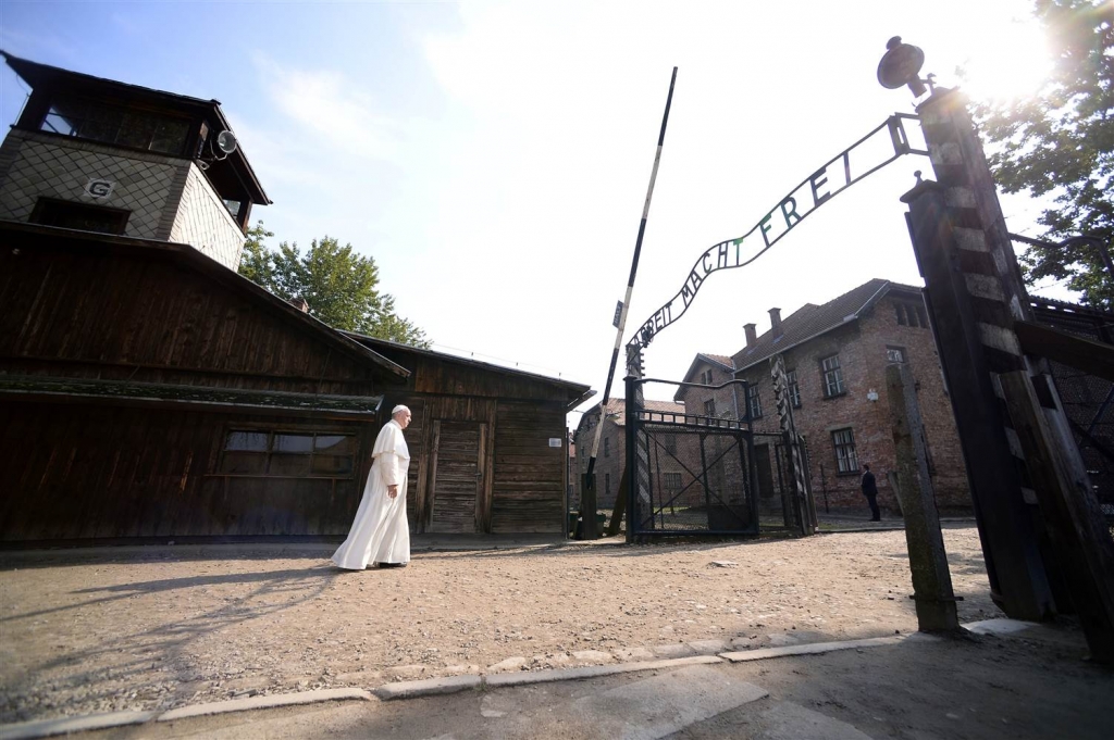 Image Pope Francis walks through Auschwitz's notorious gate during his visit to the former Nazi death camp