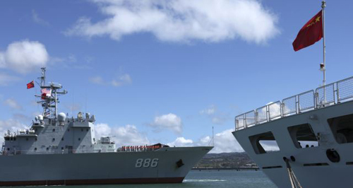 Chinese Peoples Liberation Army Navy replenishment ship left sails past a Navy hospital ship at the multi-national RIMPAC military exercise in Honolulu Hawaii