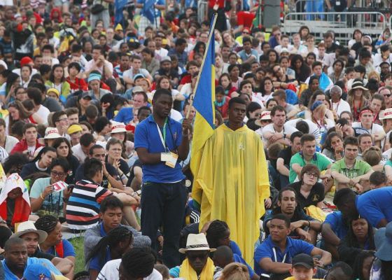 Pilgrims and faithful attend the opening Mass for