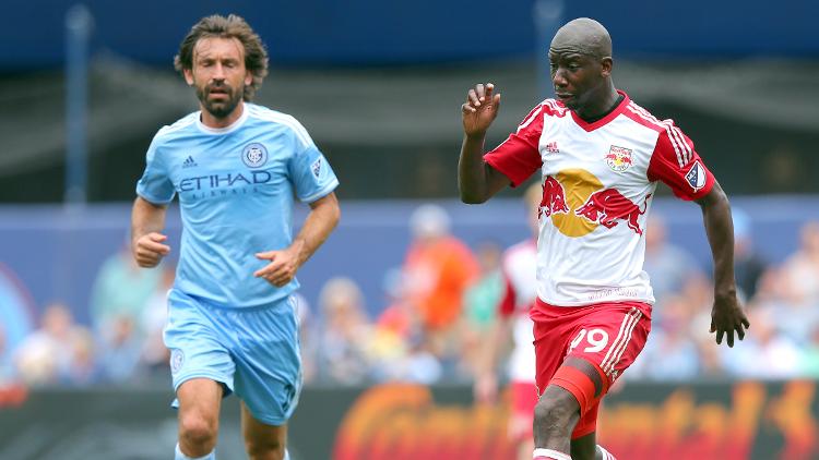 New York Red Bulls forward Bradley Wright Phillips controls the ball against New York City FC midfielder Andrea Pirlo during the second half at Yankee Stadium