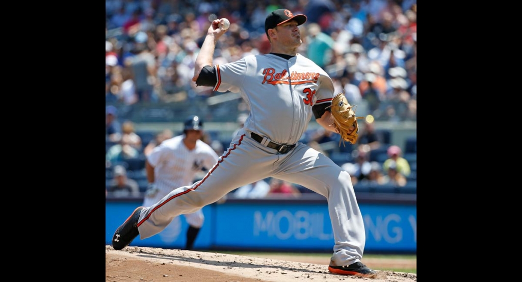 Baltimore Orioles starting pitcher Chris Tillman delivers during the first inning of a baseball game against the New York Yankees in New York Thursday