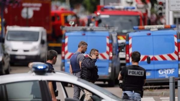 French police prevent access to the scene of the attack in Saint Etienne du Rouvray Normandy,in which an 84-year-old priest was killed when his throat was slit