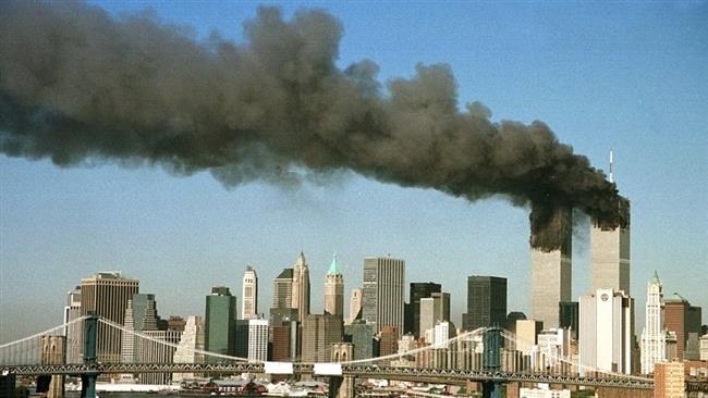 Smoke rises from the twin towers of the World Trade Center after they were hit by two hijacked airliners in a terrorist attack on Sept. 11 2001 in New York City