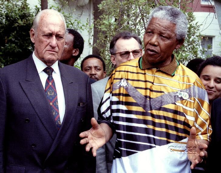 South African President Nelson Mandela speaks next to FIFA President Joao Havelange in South