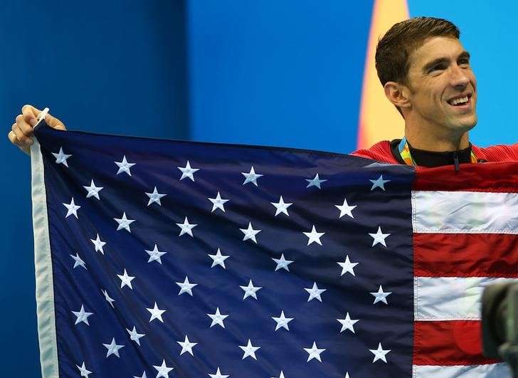 2016 Rio Olympics- Swimming- Victory Ceremony- Men's 4 x 100m Medley Relay Victory Ceremony- Olympic Aquatics Stadium- Rio de Janeiro Brazil- 13/08/2016. Michael Phelps of USA celebrates his team's gold. REUTERS  Michael Dalder