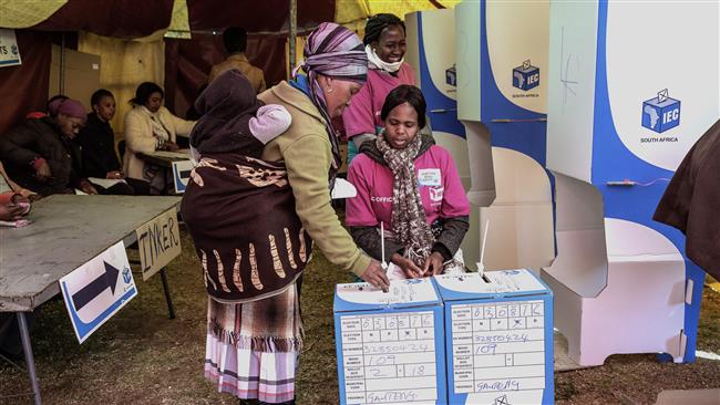 A South African woman casts her ballot during the local elections in Alexandra Township in Johannesburg South Africa