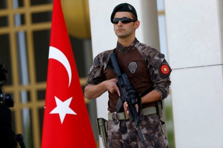 A Turkish special forces police officer guards the entrance of the Presidential Palace in Ankara Turkey