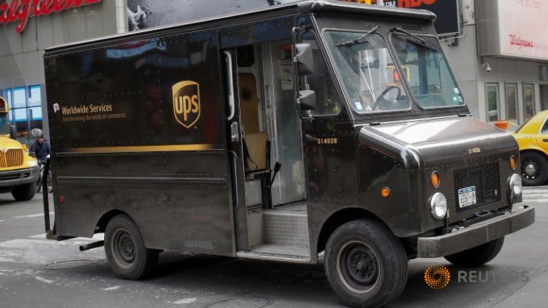 A UPS delivery truck makes its way through Times Square in New York