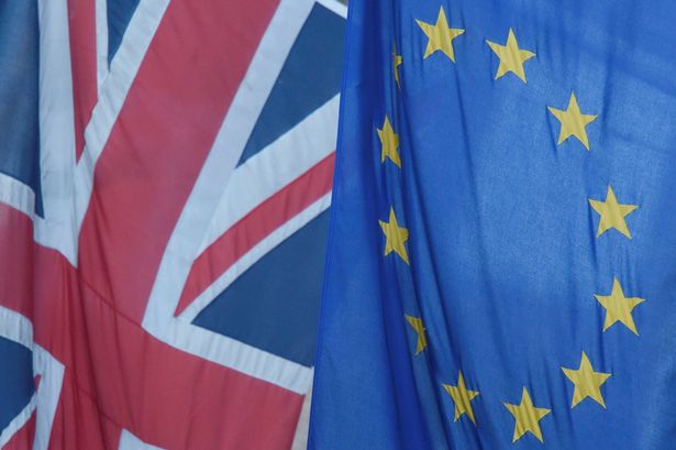 A Union flag flies next to the flag of the European Union in Westminster London