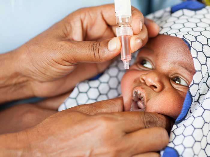 A child being vaccinated for polio