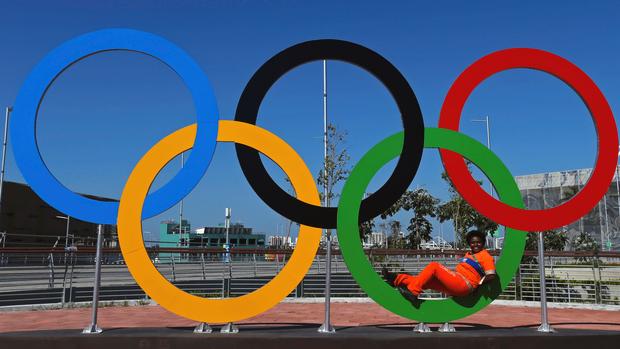 A cleaner poses in the rings at the Olympic Park in Rio de Janeiro Brazil