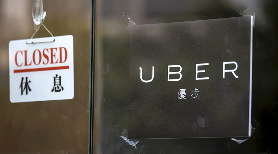 A closed sign is seen at the office of taxi-hailing service Uber Inc in Hong Kong China