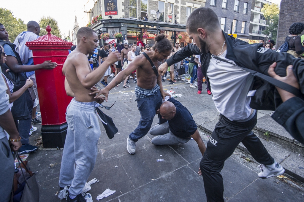 A fight breaks out on Ladbroke Grove on Monday afternoon the second day of the carnivalWENN