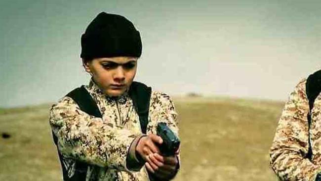 A frame grab shows a youngster carrying out an execution for Daesh