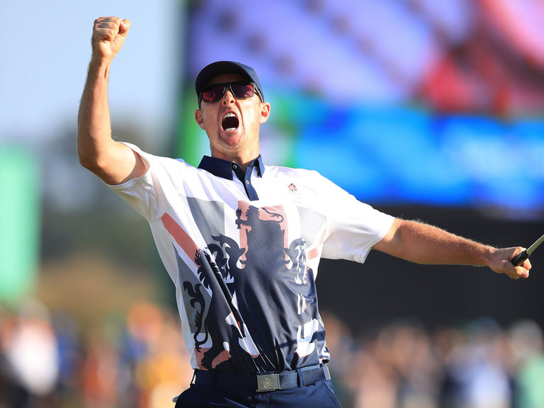 Great Britain's Justin Rose celebrates winning gold in the men's golf