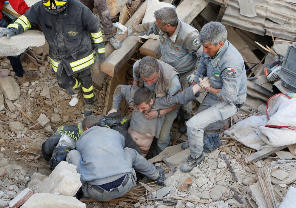 A man is rescued alive from the ruins in Amatrice Italy