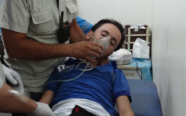 A man receives treatment after a suspected gas attack on the Syrian town of Saraqeb earlier in August