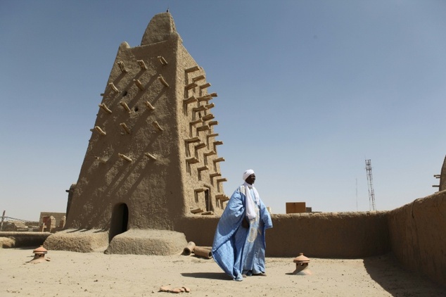 A man stands in front of the Djingareyber mosque in Timbuktu central Mali