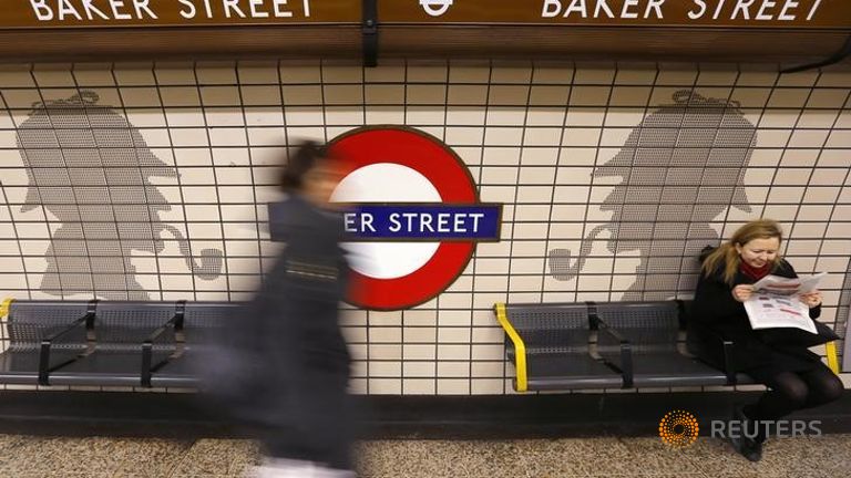 A passenger walks through Baker Street Underground station in central Lond